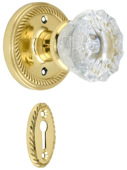 Rope Rosette Mortise Lock Set With Fluted Crystal Door Knobs in Unlacquered Brass.